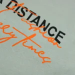 تیشرت مردانه keep your distance رنگ مغز پسته ای روشن